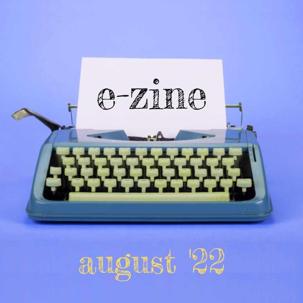 An image with a purple background and a typewriter. The typewriter has a piece of paper sticking out of it and the word "e-zine" is on the paper. Below the typewriter are the words "August '22."